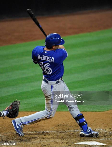 Mark DeRosa of the Toronto Blue Jays hits a solo home run during the eleventh inning of a baseball game against the San Diego Padres at Petco Park on...