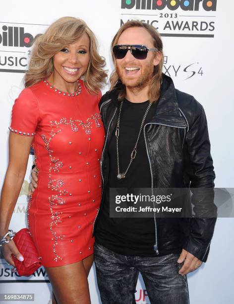 David Guetta and Cathy Guetta arrive at the 2013 Billboard Music Awards at the MGM Grand Garden Arena on May 19, 2013 in Las Vegas, Nevada.