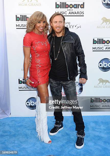 David Guetta and Cathy Guetta arrive at the 2013 Billboard Music Awards at the MGM Grand Garden Arena on May 19, 2013 in Las Vegas, Nevada.