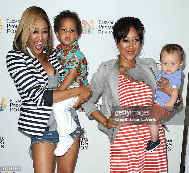 Actress Tia Mowry, son Cree Hardrict, actress Tamera Mowry and son Aden Housley attend the Elizabeth Glaser Pediatric AIDS Foundation's 24th annual...