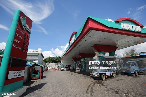 Vehicles refuel at an MMTM gas station in Yangon, Myanmar, on Sunday, June 2, 2013. Myanmar may attract as much as $100 billion in foreign direct...