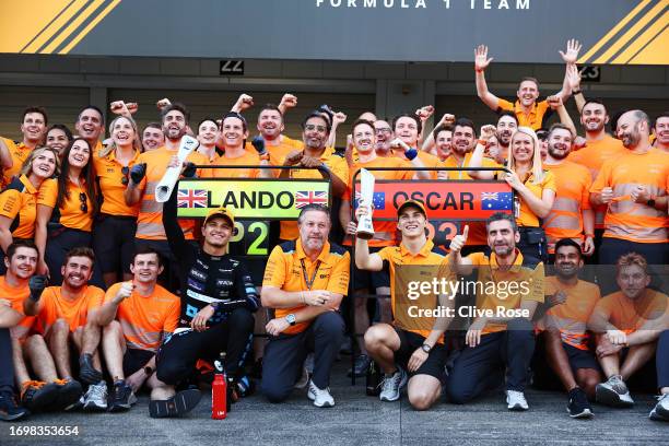 Second placed Lando Norris of Great Britain and McLaren, Third placed Oscar Piastri of Australia and McLaren, McLaren Chief Executive Officer Zak...