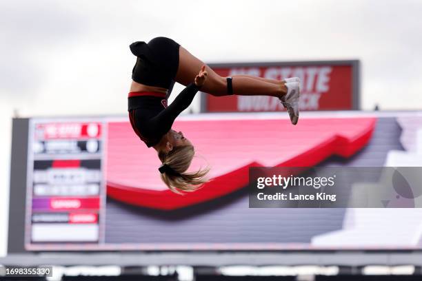 Cheerleader of the NC State Wolfpack performs prior to the game against the Louisville Cardinals at Carter-Finley Stadium on September 29, 2023 in...