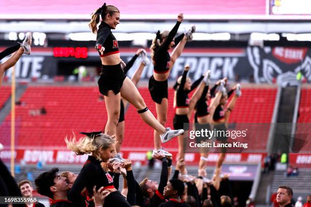 Cheerleaders of the NC State Wolfpack perform prior to the game against the Louisville Cardinals at Carter-Finley Stadium on September 29, 2023 in...