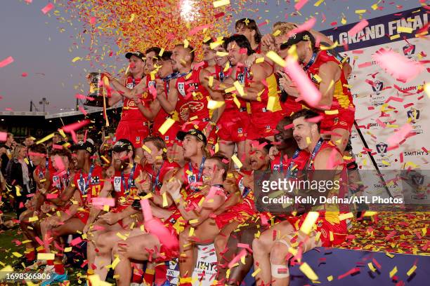Gold Coast Suns pose with the VFL Premiership Cup and celebrate winning the VFL Grand Final match between Gold Coast Suns and Werribee at Ikon Park...