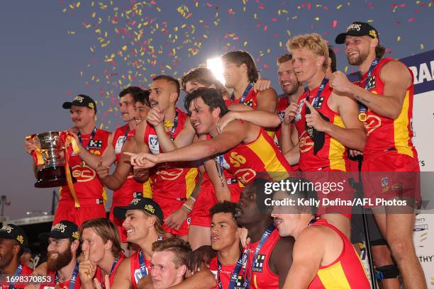 Gold Coast Suns pose with the VFL Premiership Cup and celebrate winning the VFL Grand Final match between Gold Coast Suns and Werribee at Ikon Park...