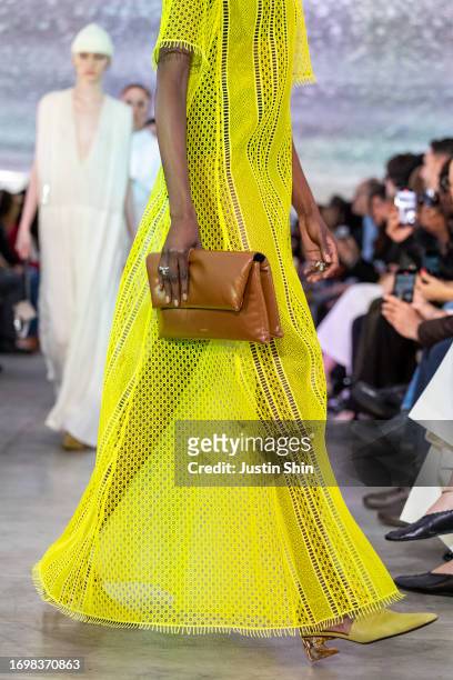 Model, bag detail, walks the runway at the Jil Sander fashion show during the Milan Fashion Week Womenswear Spring/Summer 2024 on September 23, 2023...