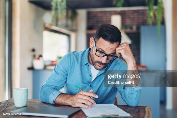 stressed man working at home - worry business stock pictures, royalty-free photos & images