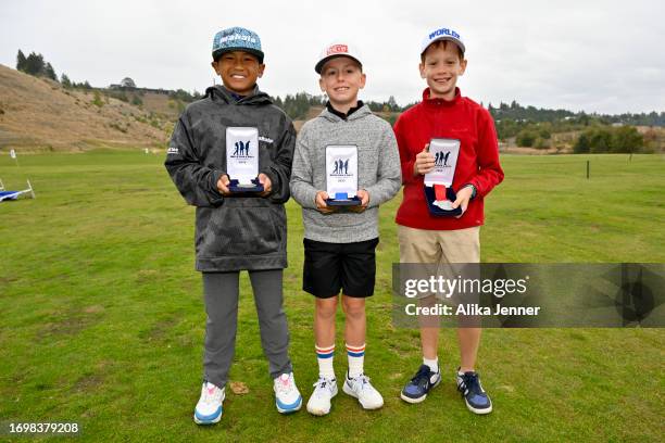 Participants of the boys 10-11 division, Raiden Orille, Emery Johnson, and Alexander Chitty, pose for a photo during the 2023 Drive, Chip and Putt...