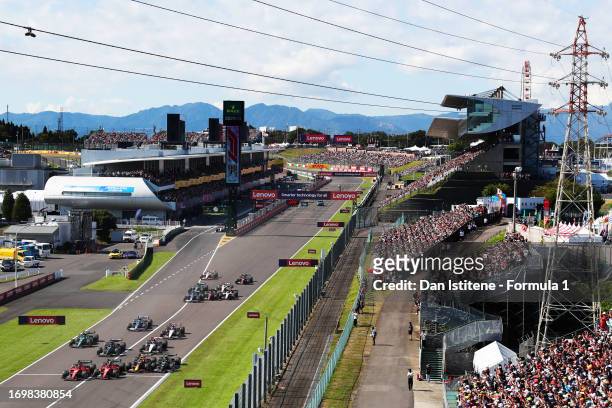 Charles Leclerc of Monaco driving the Ferrari SF-23, Carlos Sainz of Spain driving the Ferrari SF-23, Sergio Perez of Mexico driving the Oracle Red...