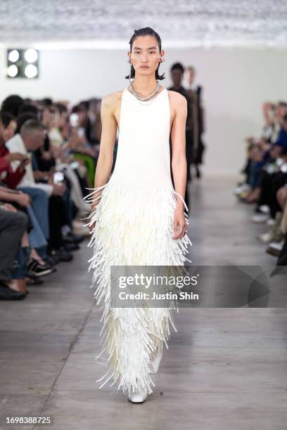 Model walks the runway at the Jil Sander fashion show during the Milan Fashion Week Womenswear Spring/Summer 2024 on September 23, 2023 in Milan,...