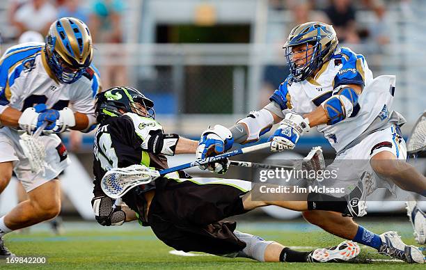 Casey Cittadino of the Charlotte Hounds in action against Stephen Berger of the New York Lizards during their Major League Lacrosse game at Shuart...