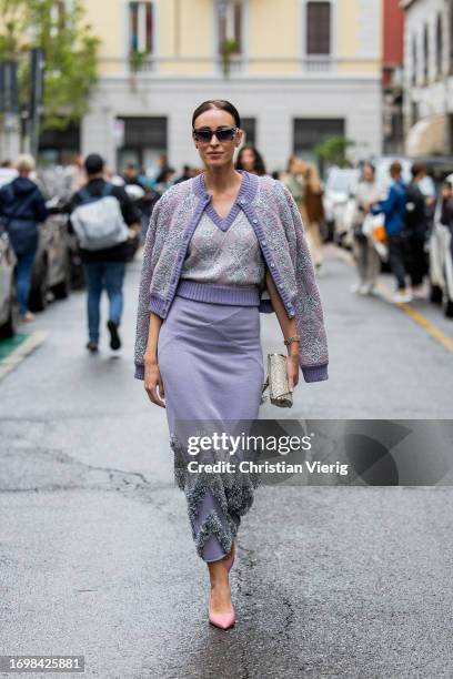 Elvira Jain wears lavender skirt, cardigan, v neck top, pink pointed heels, bag, sunglasses outside Missoni during the Milan Fashion Week -...