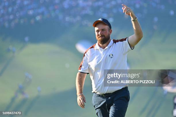 Non-playing Europe's Irish golfer, Shane Lowry reacts on the 15th green during the four-ball matches on the second day of play in the 44th Ryder Cup...