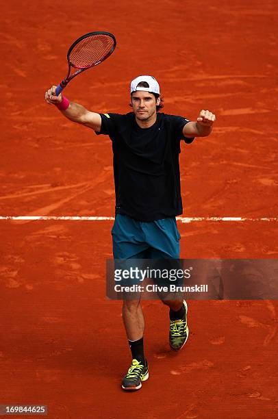 Tommy Haas of Germany celebrates match point during his Men's Singles match against Mikhail Youzhny of Russian Federation on day nine of the French...