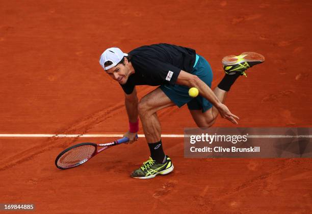 Tommy Haas of Germany plays a forehand during his Men's Singles match against Mikhail Youzhny of Russian Federation on day nine of the French Open at...