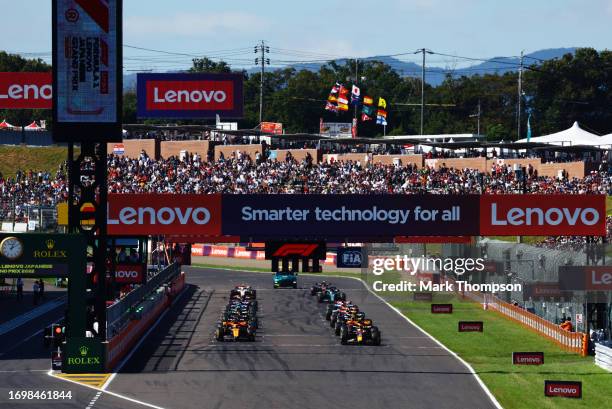 Max Verstappen of the Netherlands driving the Oracle Red Bull Racing RB19 and Oscar Piastri of Australia driving the McLaren MCL60 Mercedes line up...