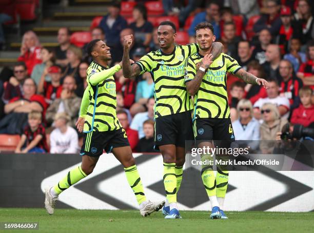 Reiss Nelson and Gabriel Magalhaes of Arsenal celebrates with scorer of the 4th goal Ben White during the Premier League match between AFC...