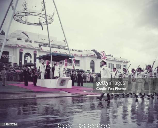 Queen Elizabeth II and Prince Philip inspect the guard of honour in Canberra during their visit to Australia, 1954.