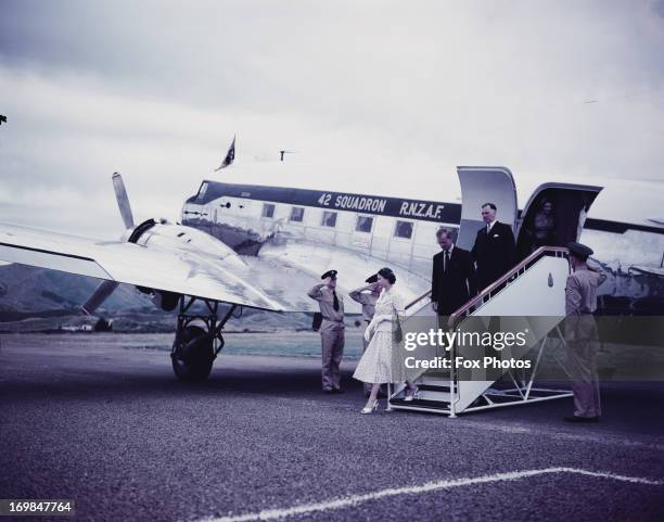 Queen Elizabeth II and Prince Philip, the Duke of Edinburgh, are pictured leaving the aeroplane at Westport Airport during her Commonwealth visit to...