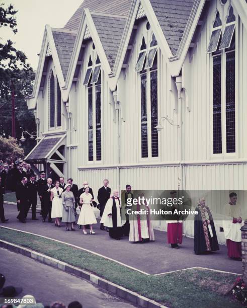 Queen Elizabeth II and Prince Philip leave Divine Service conducted by the Bishop of Auckland at St. Mary's Cathedral, Auckland, New Zealand, 1954.