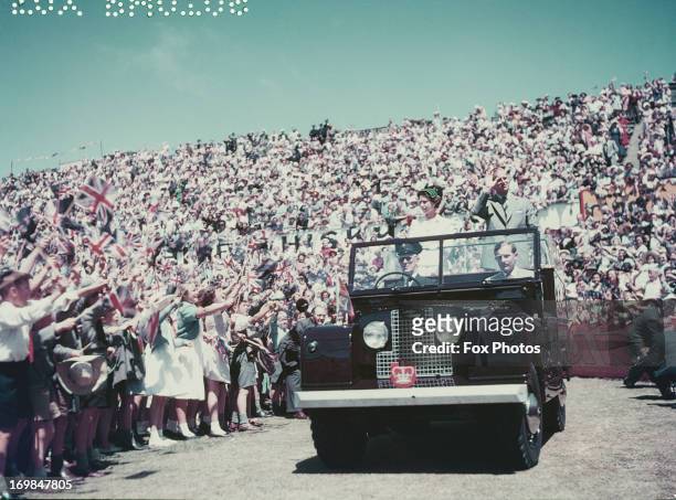 Queen Elizabeth II and Prince Philip wave to the crowd whilst on their Commonwealth visit to Australia, 1954.