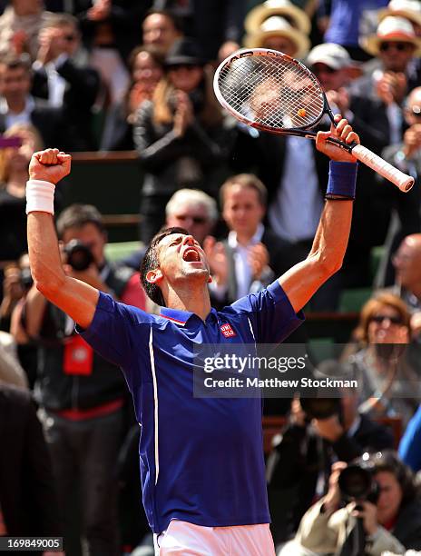 Novak Djokovic of Serbia celebrates match point in his Men's Singles match against Philipp Kohlschreiber of Germany on day nine of the French Open at...