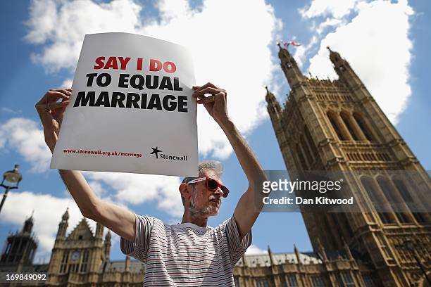 Proponent of same sex marriage protest outside the Houses of Parliament on June 3, 2013 in London, England. A government bill allowing same sex...