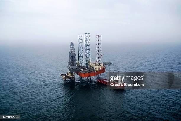 Supply ship is seen beside an offshore jack-up rig, operated by Chornomornaftogaz, a division of NAK Naftogaz Ukrainy, in the Odessa gas field in the...