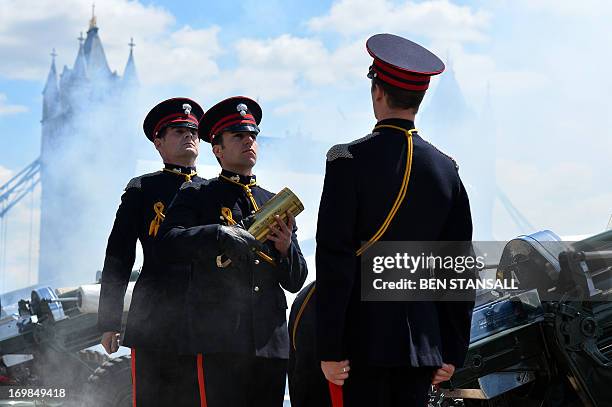 Members of the Honourable Artillery Company , the City of London’s Territorial Army regiment, handle a blank cartridge as they prepare to fire a 62...