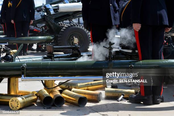 Spent blank shell casings litter the floor about the feet of members of the Honourable Artillery Company , the City of London’s Territorial Army...