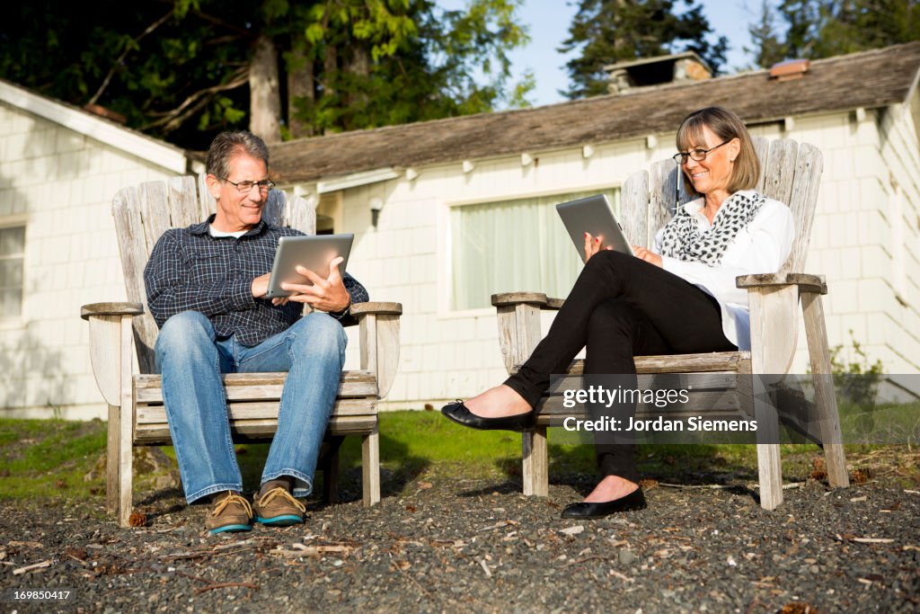 An older couple using an tablet computer.