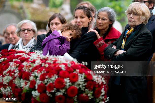 Wife of late Guy Carcassonne, Claire Bretecher stands on June 3, 2013 at the Montmartre cemetery in Paris, during the funeral of the French...