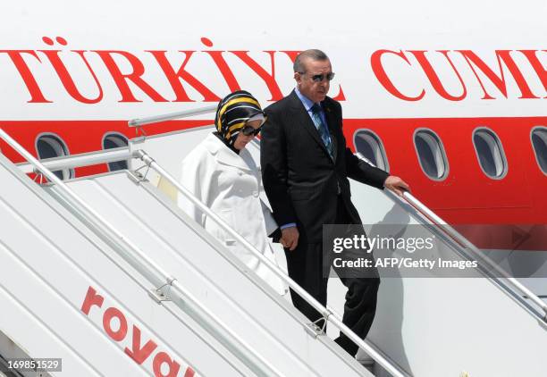 Turkish Prime Minister Recep Tayyip Erdogan and his wife Emine arrive at Rabat airport on June 3, 2013 at the start of a tour of the Maghreb region...
