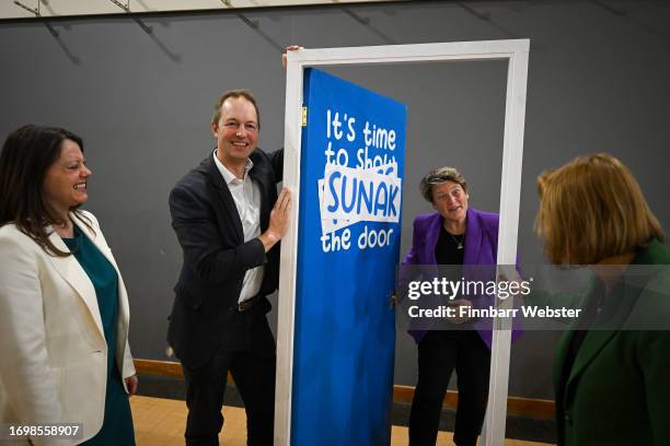 Liberal Democrat by-election winners, Sarah Green, Richard Foord, Sarah Dyke and Helen Morgan, have fun with the door prop during a visit to their...