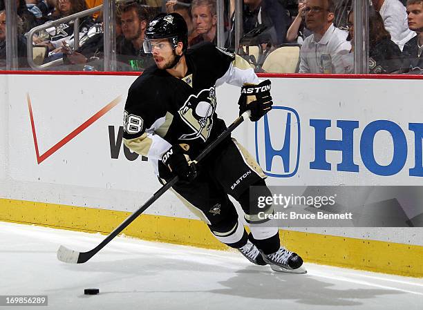 Tyler Kennedy of the Pittsburgh Penguins skates with the puck against the Boston Bruins during Game One of the Eastern Conference Final of the 2013...