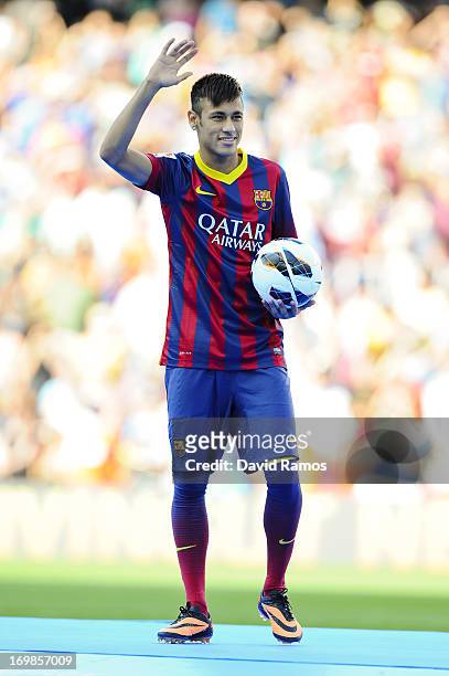 Neymar poses for the media after signing as a new player of the FC Barcelona at Camp Nou Stadium on June 3, 2013 in Barcelona, Spain.
