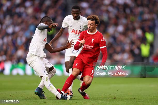 Curtis Jones of Liverpool fouls Yves Bissouma of Tottenham Hotspur before being shown a red card during the Premier League match between Tottenham...