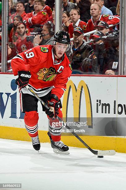 Jonathan Toews of the Chicago Blackhawks takes control of the puck in Game Seven of the Western Conference Semifinals against the Detroit Red Wings...