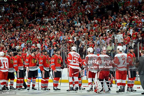 The Chicago Blackhawks and Detroit Red Wings shake hands after the Blackhawks defeated the Red Wings 2-1 to take the series in Game Seven of the...