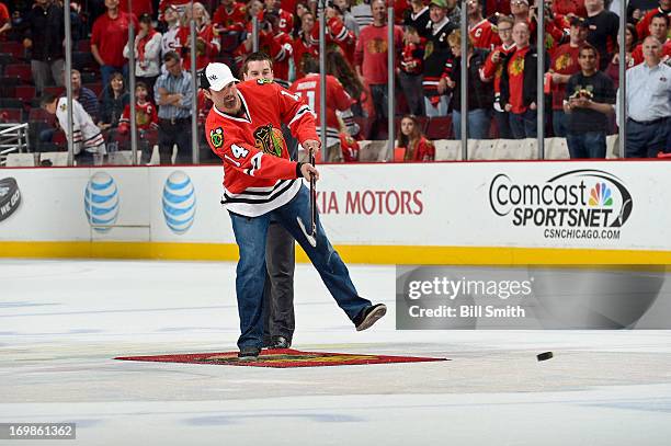 Chicago White Sox first baseman Paul Konerko shoots the puck in between periods of Game Seven of the Western Conference Semifinals between the...