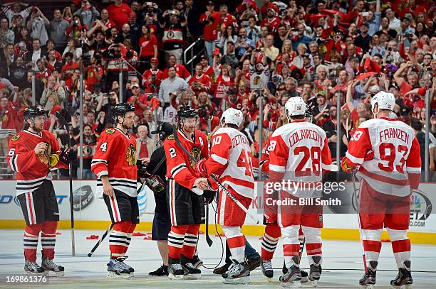 The Chicago Blackhawks and Detroit Red Wings shake hands after the Blackhawks defeated the Red Wings 2-1 to take the series in Game Seven of the...