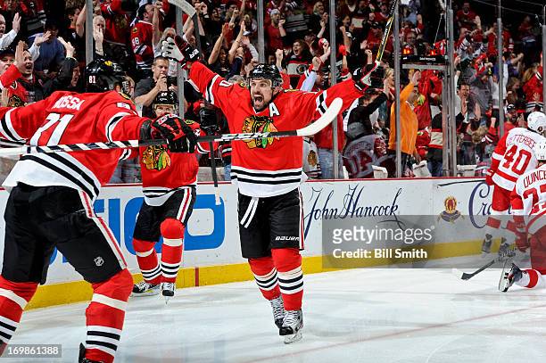 Patrick Sharp of the Chicago Blackhawks reacts after scoring in the second period against the Detroit Red Wings in Game Seven of the Western...
