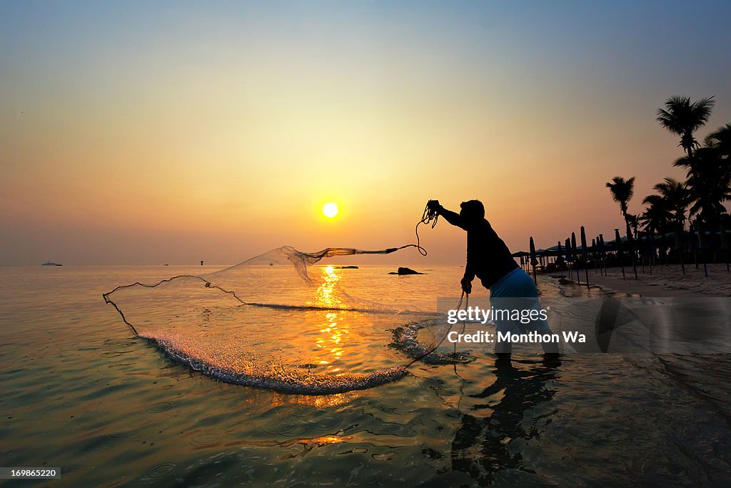 Fisherman catching a fish.