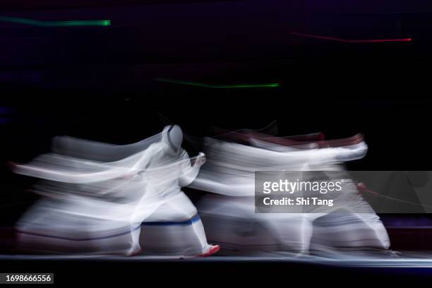 Choi Chun Yin Ryan of Hong Kong competes in the Men's Foil Individual Semi Finals match against Chen Haiwei of China during day one of the 19th Asian...