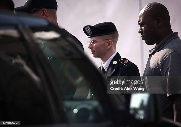 Army Private First Class Bradley Manning is escorted as he leaves a military court for the day June 3, 2013 at Fort Meade in Maryland. Manning was...