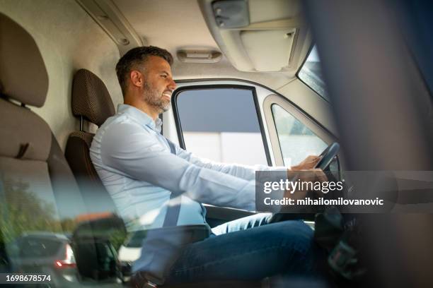 manager driving his van - man driving van stock pictures, royalty-free photos & images