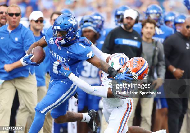 Kentucky Wildcats running back Ray Davis battles Florida Gators safety Miguel Mitchell in a game between the Florida Gators and the Kentucky Wildcats...