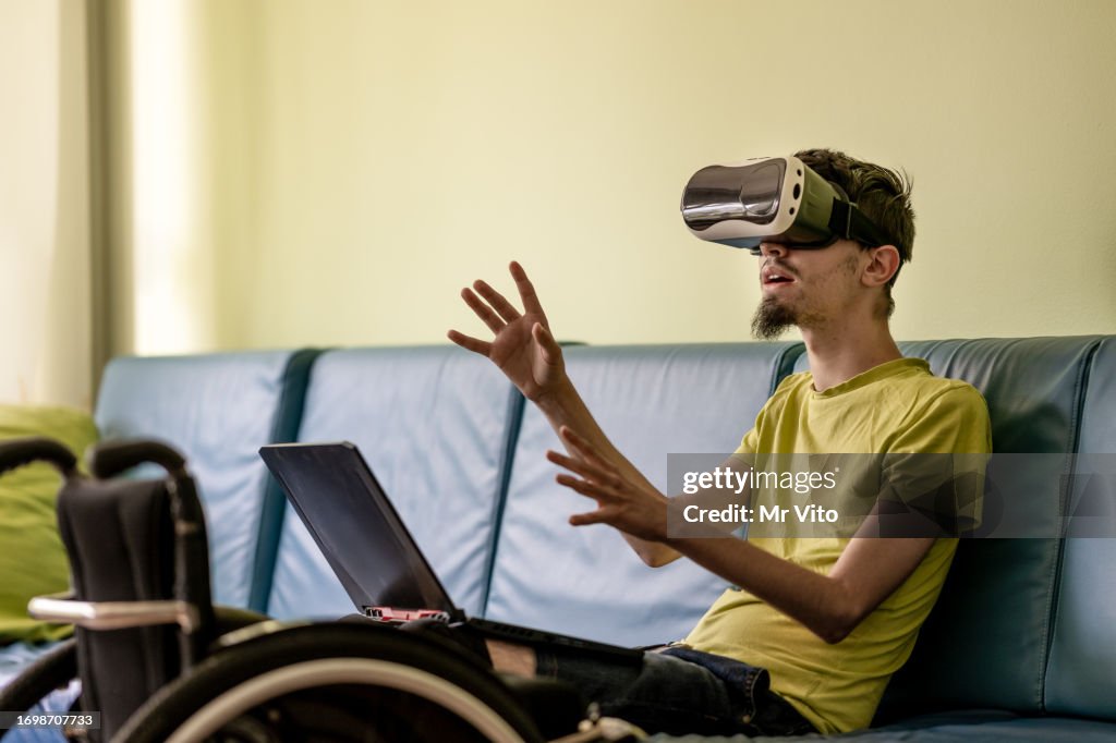 Disabled teenager with digital devices.