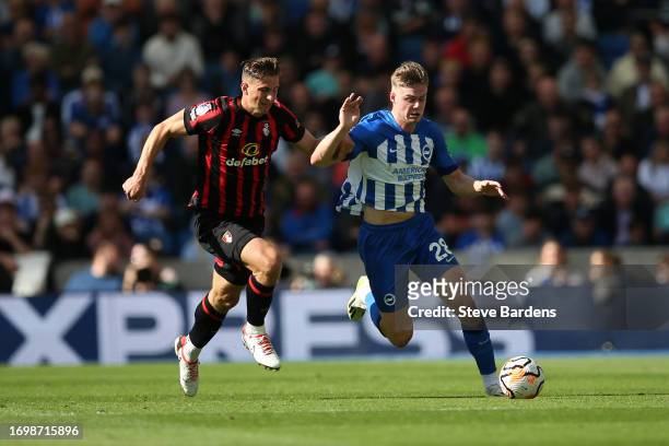 Evan Ferguson of Brighton & Hove Albion runs with the ball whilst under pressure from Illya Zabarnyi of AFC Bournemouth during the Premier League...